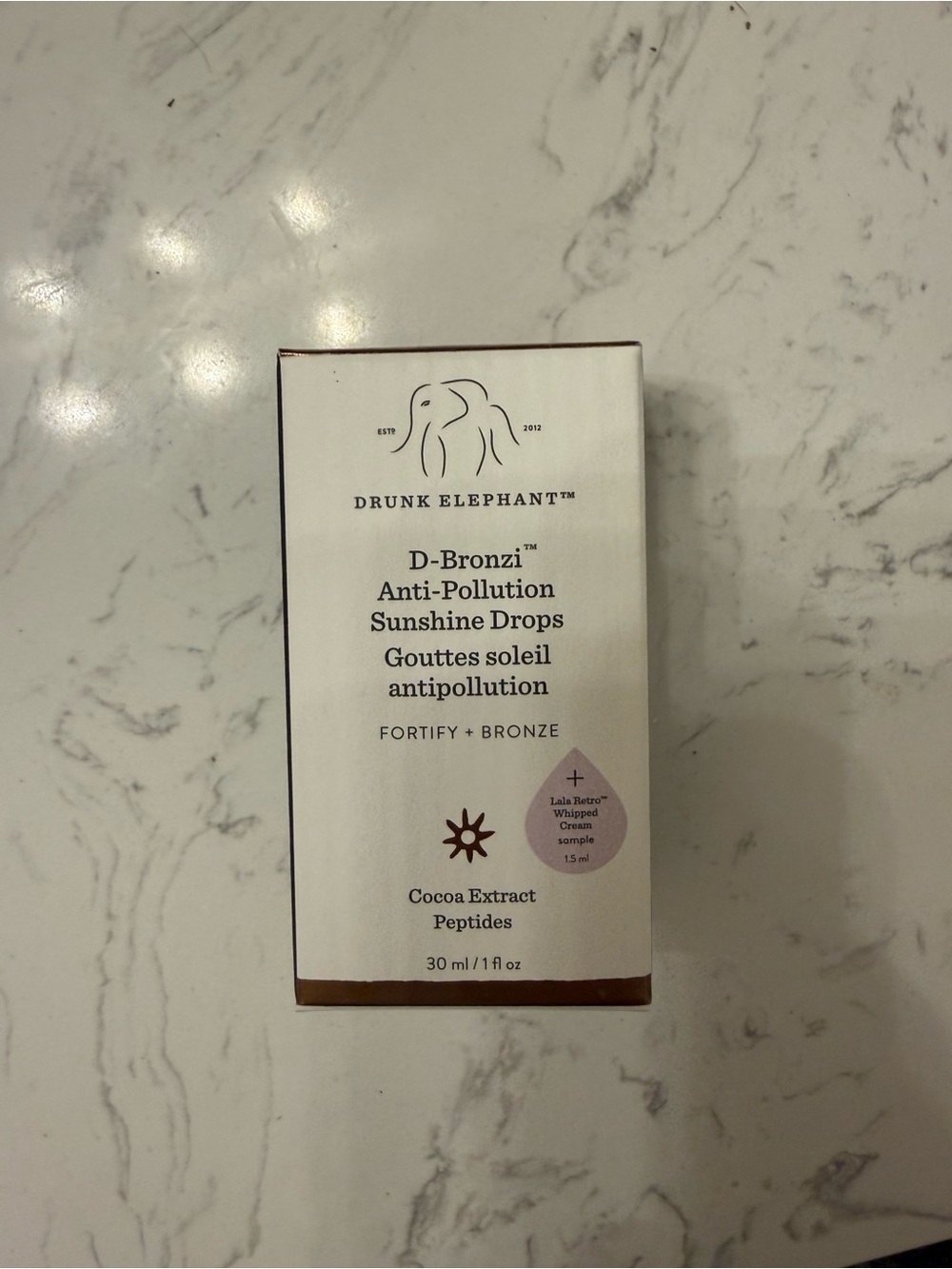 Drunk Elephant D-Bronzi Anti-Pollution Sunshine Drops – White & Bronze Packaging